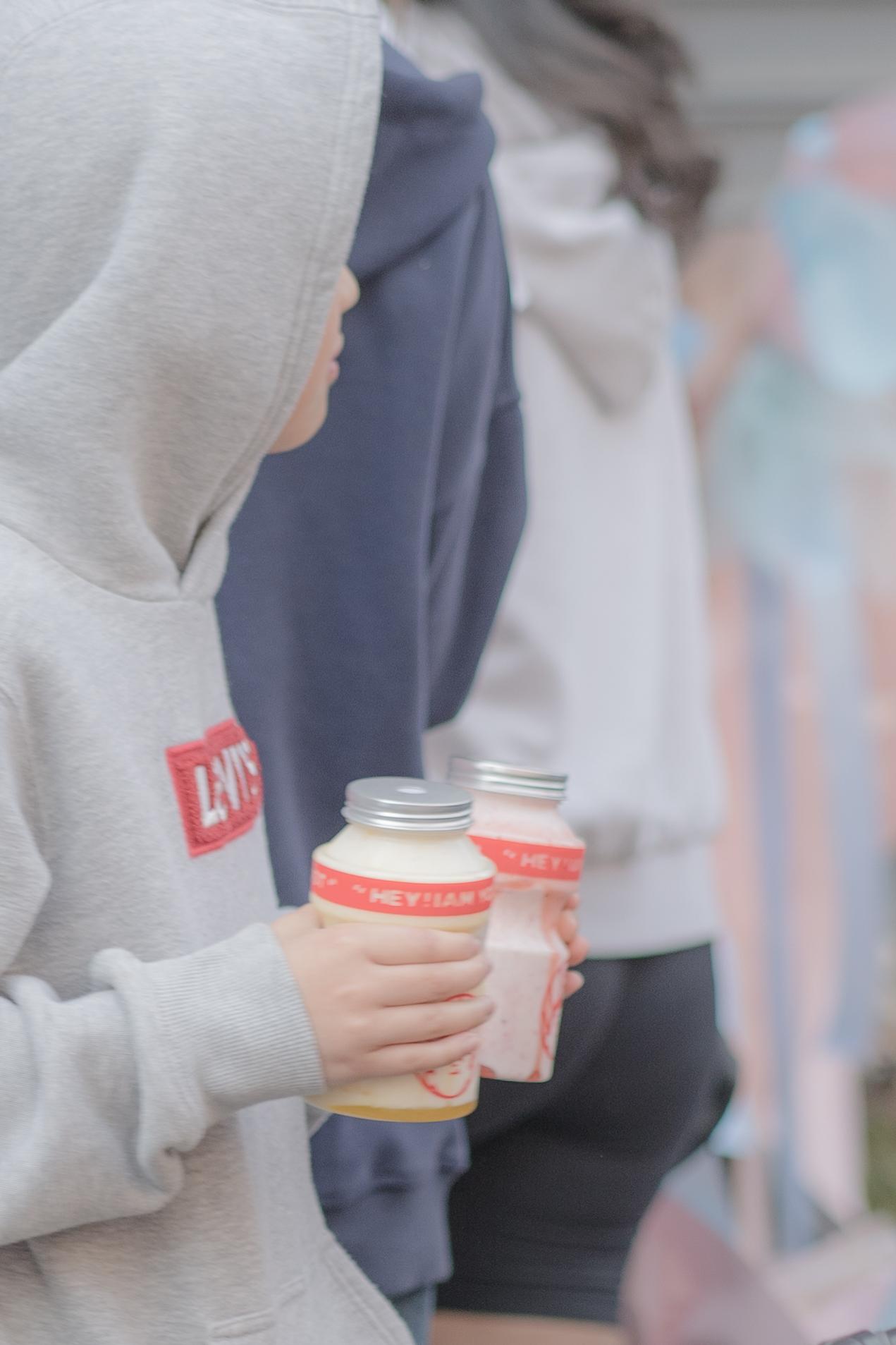 Customers carrying bottled Yogost drinks