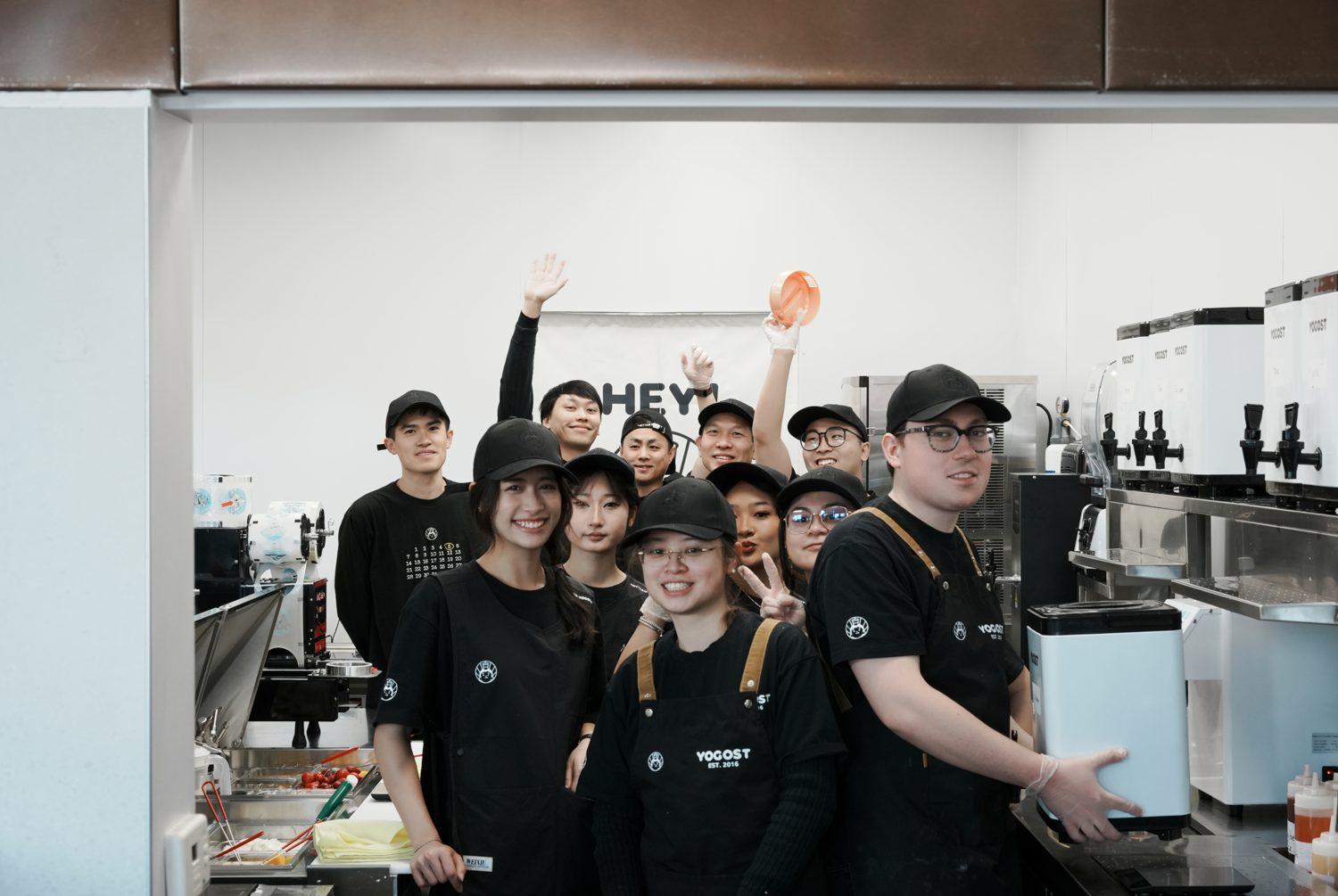 The Edmonton Yogost team gathered behind the counter